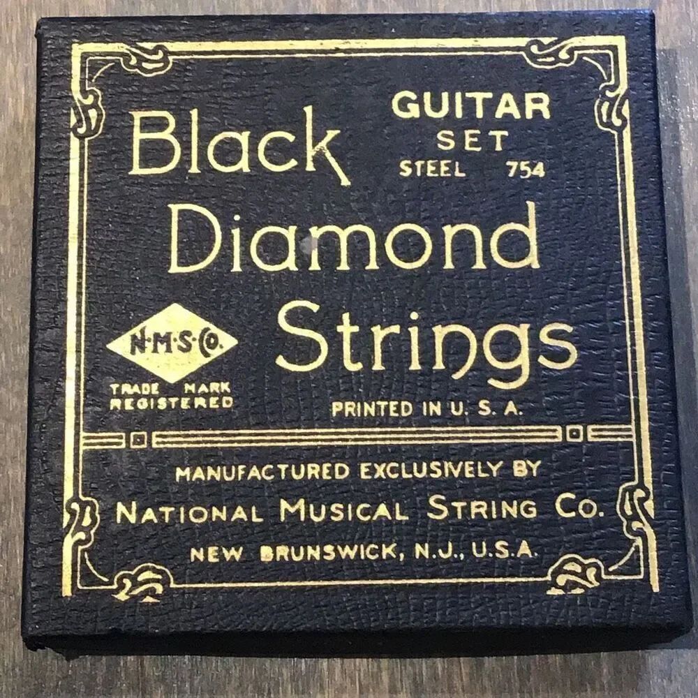 Vintage guitar, strings by black diamond set of five